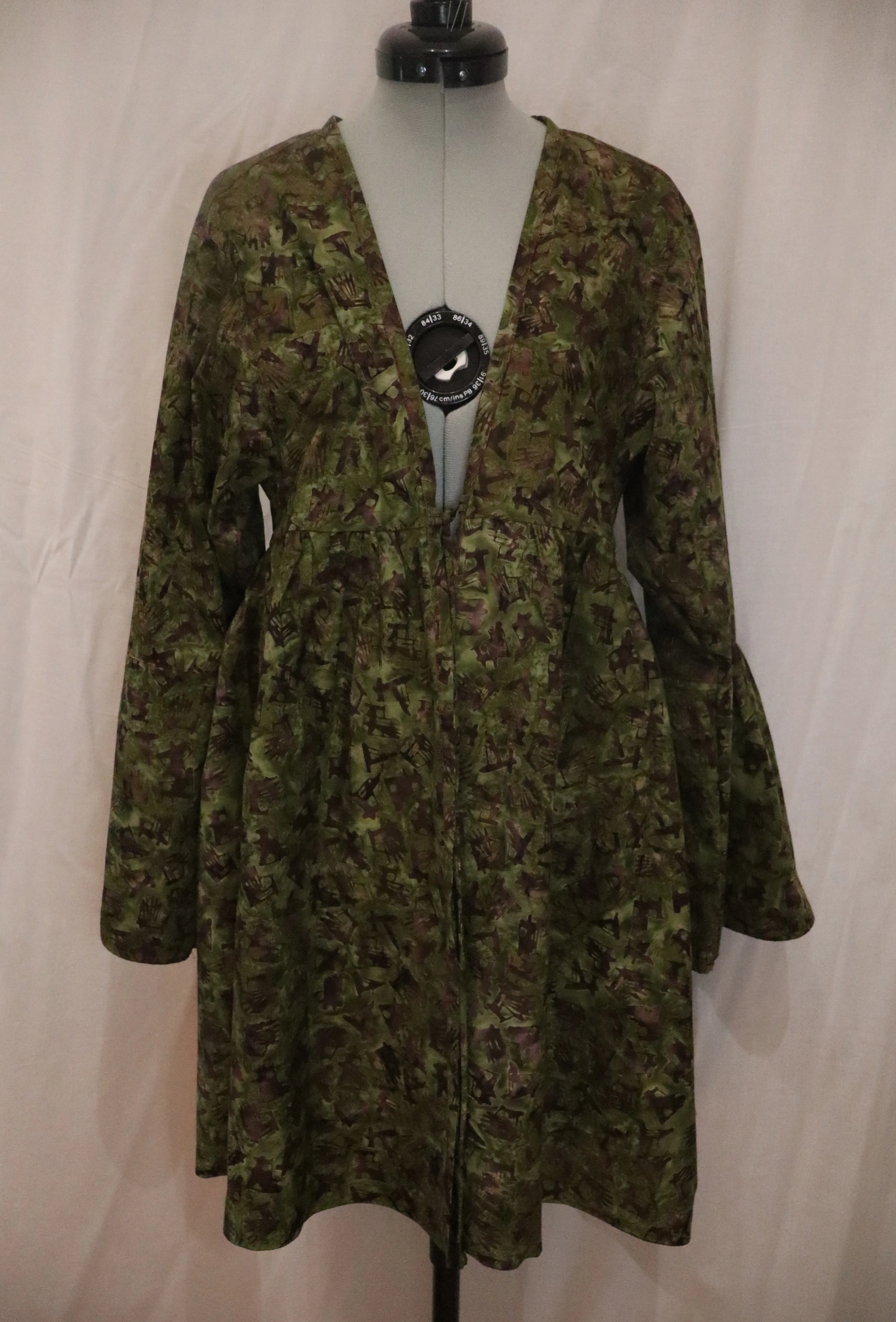 Front of the Coat of the Cricket's Song