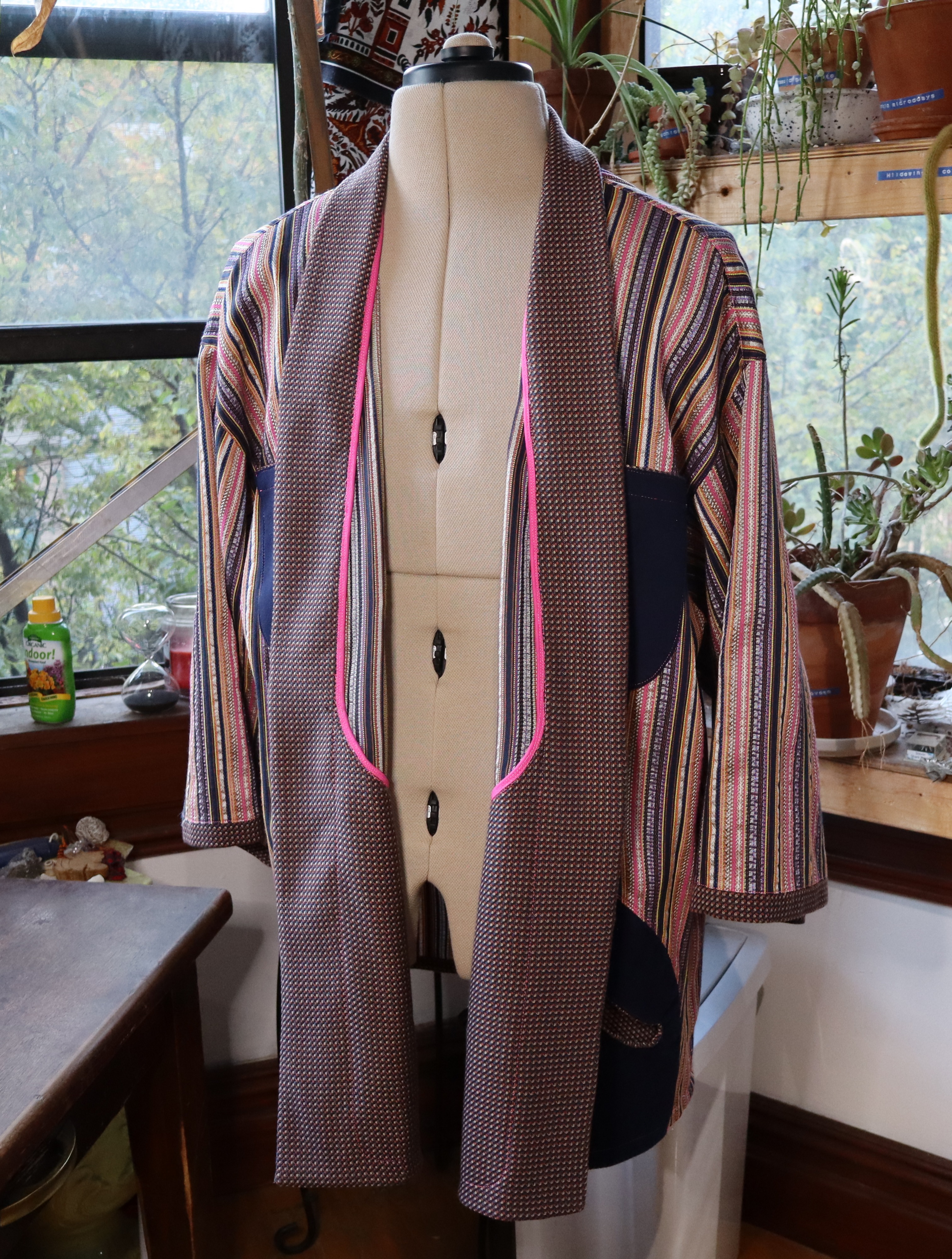 Facing folded to expose flashing on the Caftan for 100,000,000,000 Birds