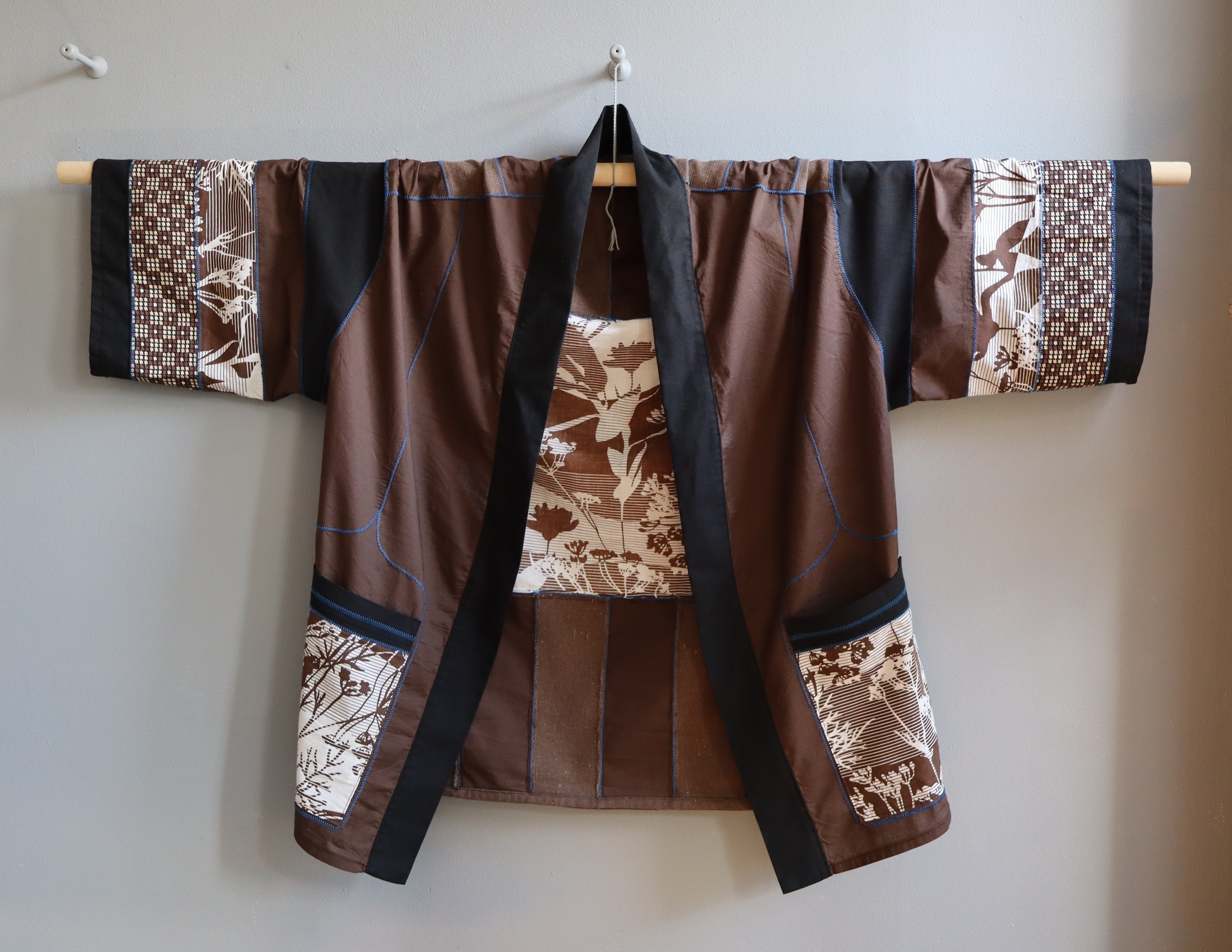 Front of the Robe of the Earth's Flourishing in Space, hanging open to show the pockets