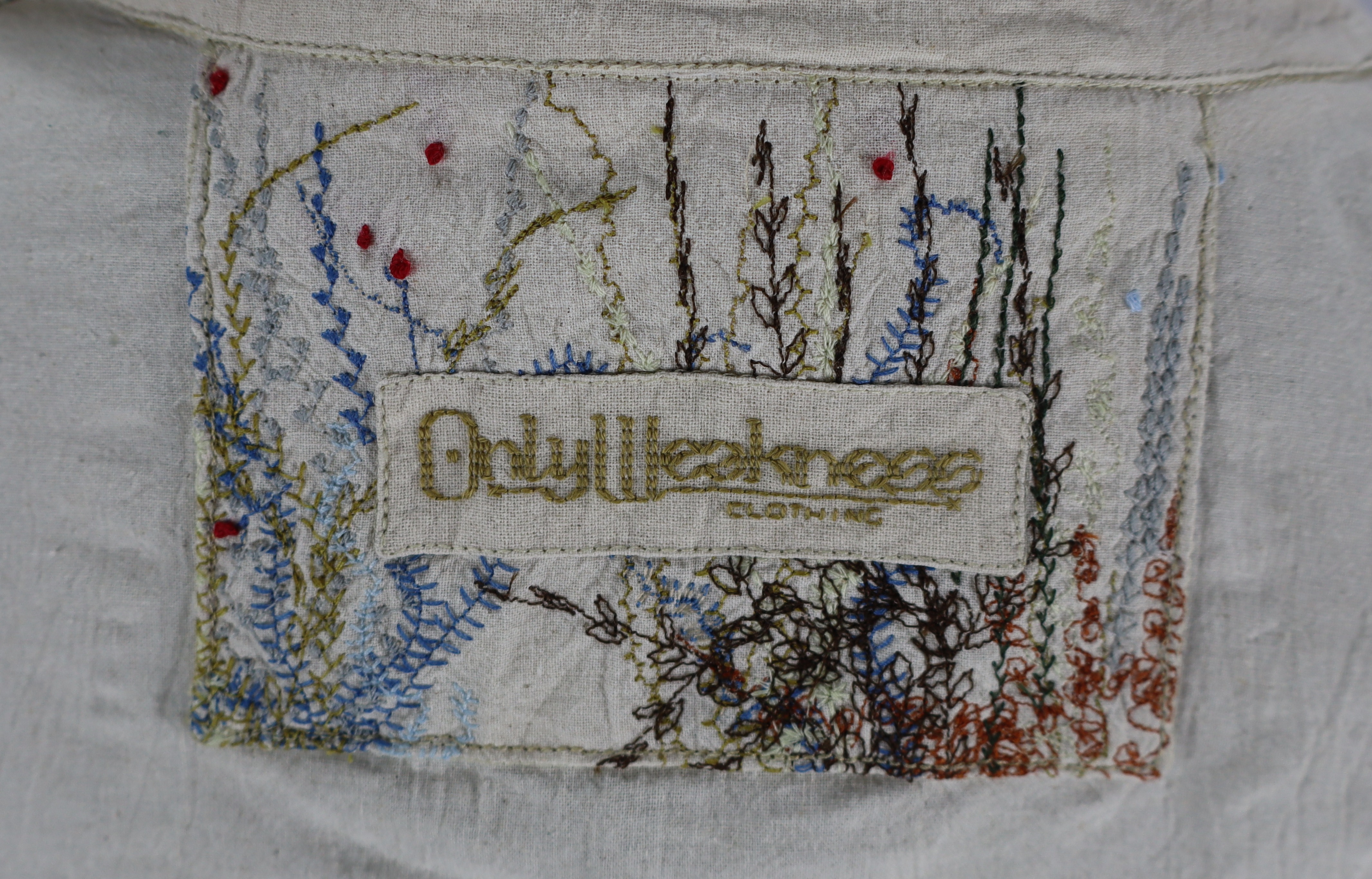 Close view of the tag on the Rewilded Jacket