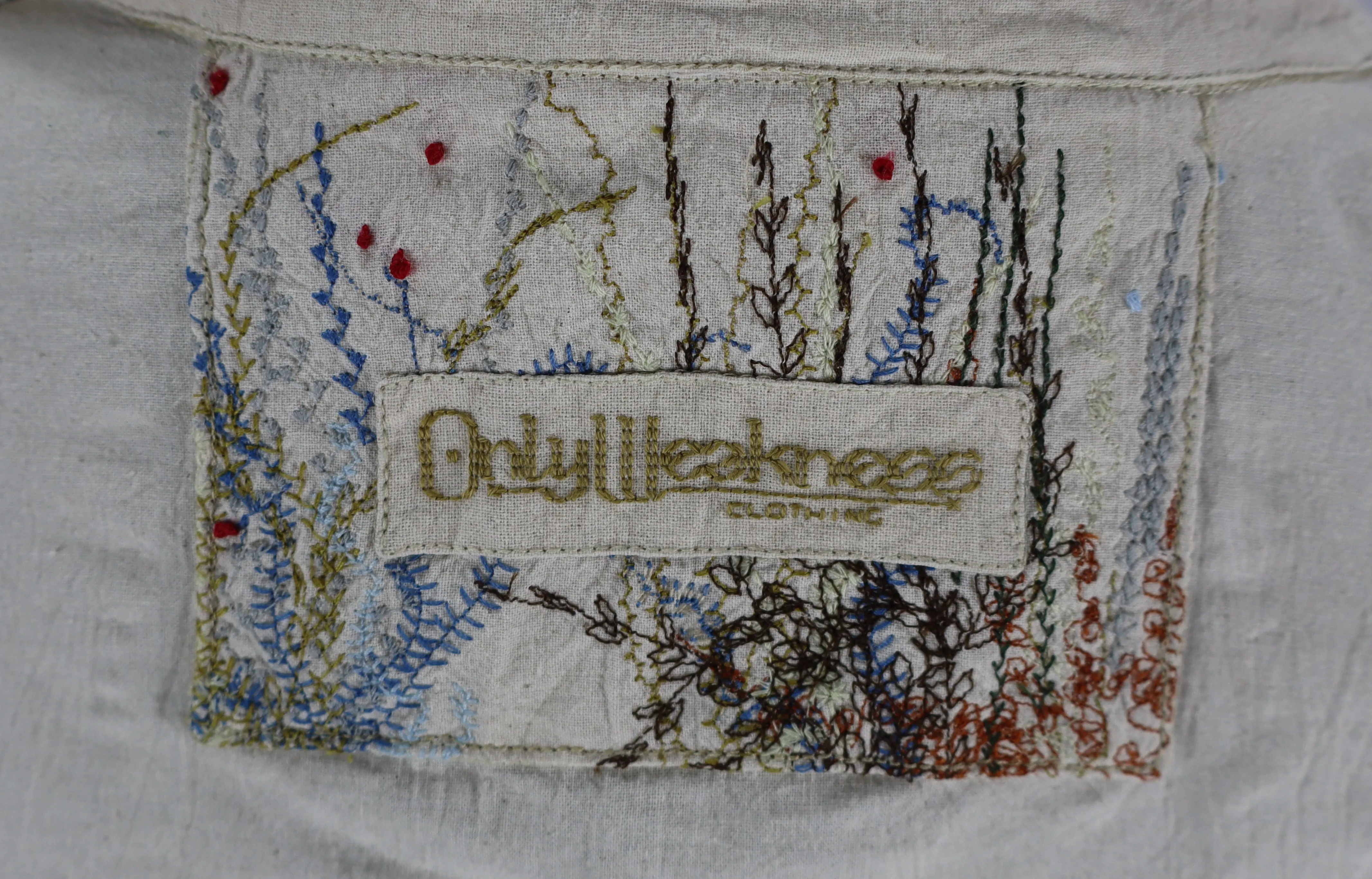 Close view of the tag on the Rewilded Jacket